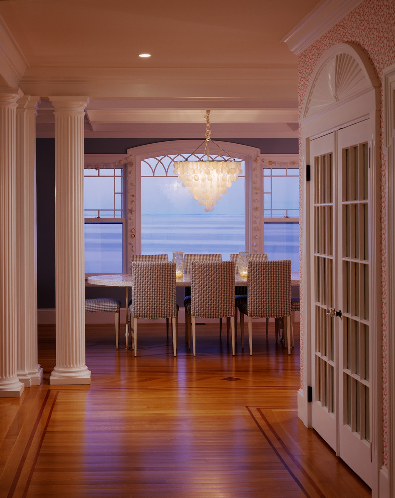 Photo of a large beach style kitchen/dining combo in Boston with blue walls and light hardwood floors.