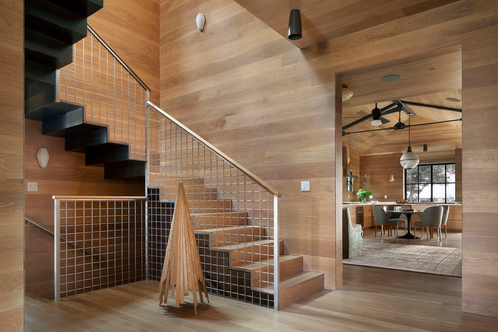 Photo of a contemporary wood l-shaped staircase in San Francisco with wood risers.