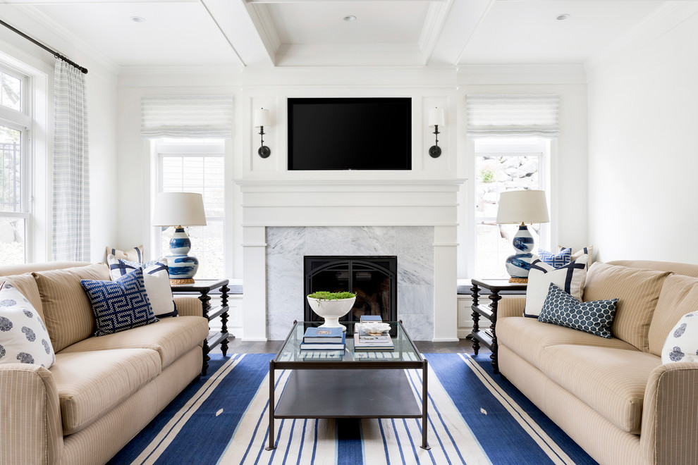 Inspiration for a transitional living room in Minneapolis with white walls, a standard fireplace, a stone fireplace surround and a wall-mounted tv.