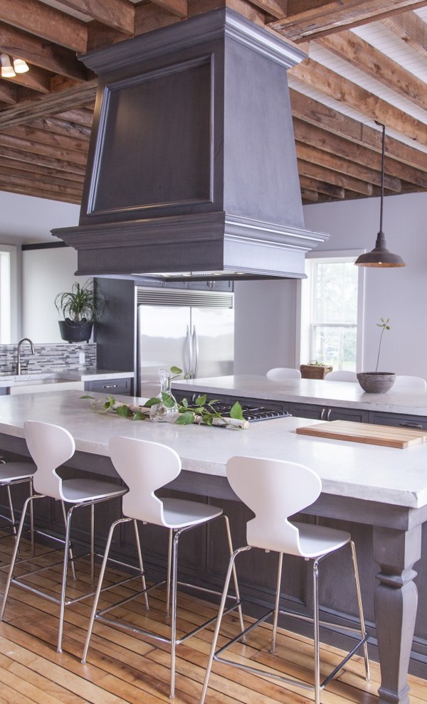 Eat-in kitchen - rustic medium tone wood floor and brown floor eat-in kitchen idea with a farmhouse sink, gray cabinets, concrete countertops, gray backsplash, stainless steel appliances, two islands and gray countertops