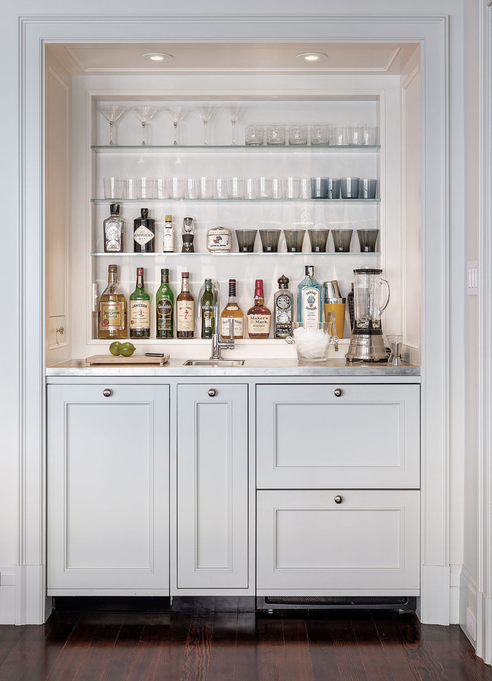 Photo of a small transitional wet bar in San Francisco with dark hardwood floors, an undermount sink, shaker cabinets, white cabinets and stainless steel benchtops.