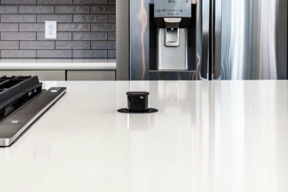 Eat-in kitchen - large transitional u-shaped vinyl floor and gray floor eat-in kitchen idea with an undermount sink, shaker cabinets, gray cabinets, quartzite countertops, green backsplash, subway tile backsplash, stainless steel appliances, an island and white countertops