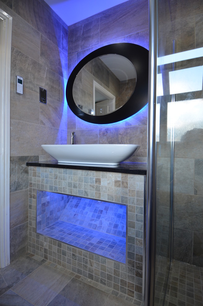 This is an example of a small contemporary bathroom in Gloucestershire with multi-coloured walls and porcelain floors.