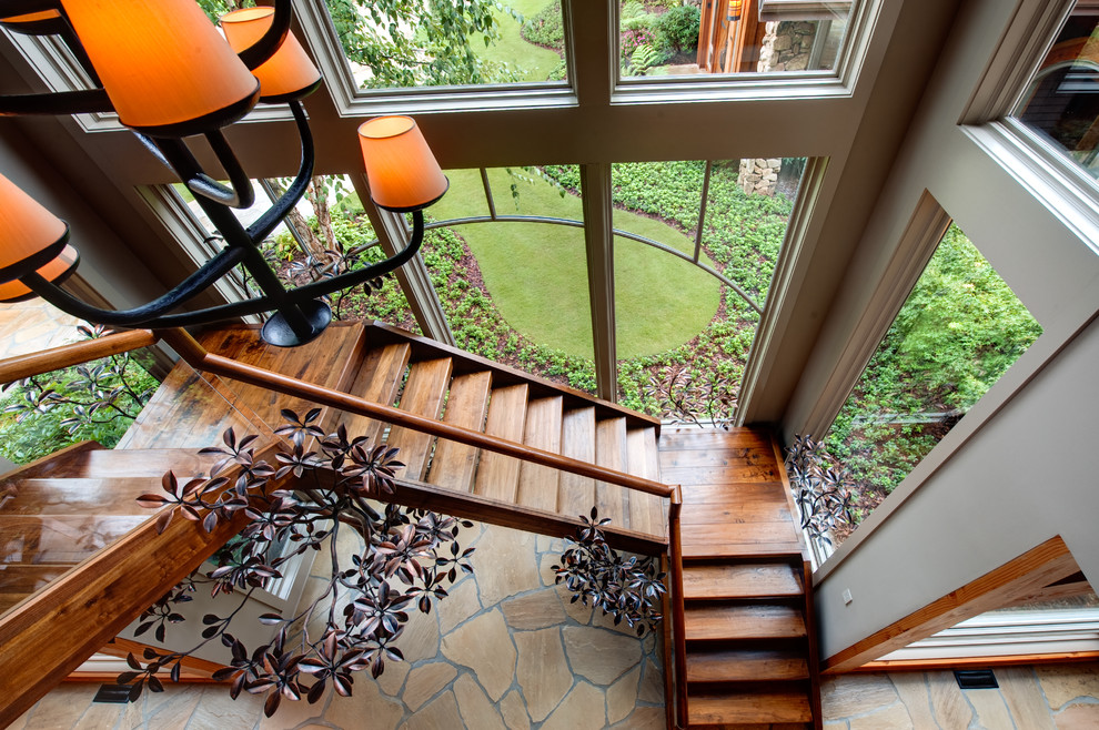 Inspiration for a country wood floating staircase in Atlanta with open risers.