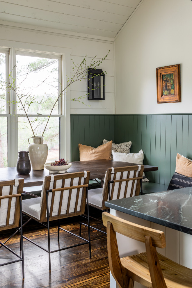 This is an example of a rustic dining room in Atlanta with a dado rail.