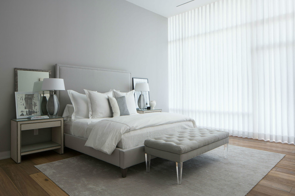 Inspiration for a modern master light wood floor bedroom remodel in Dallas with gray walls
