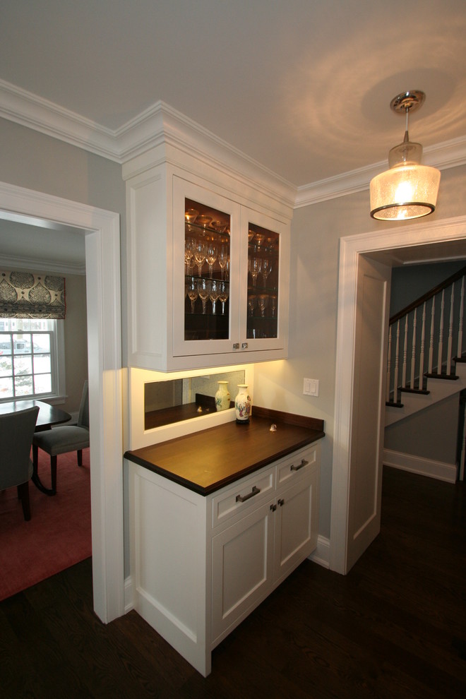 Large transitional l-shaped dark wood floor open concept kitchen photo in Chicago with flat-panel cabinets, white cabinets, granite countertops, blue backsplash, ceramic backsplash, stainless steel appliances and an island