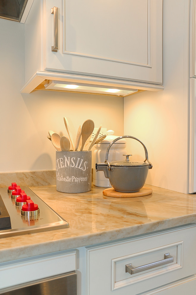Small transitional galley light wood floor eat-in kitchen photo in Chicago with an undermount sink, recessed-panel cabinets, white cabinets, quartzite countertops, gray backsplash, stone slab backsplash, stainless steel appliances and a peninsula