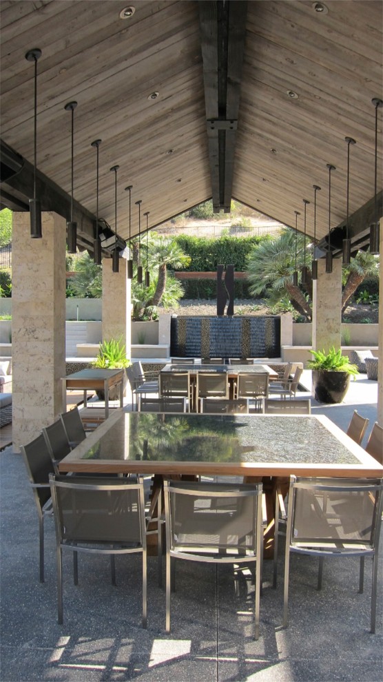 Inspiration for a contemporary patio in San Diego with a water feature.