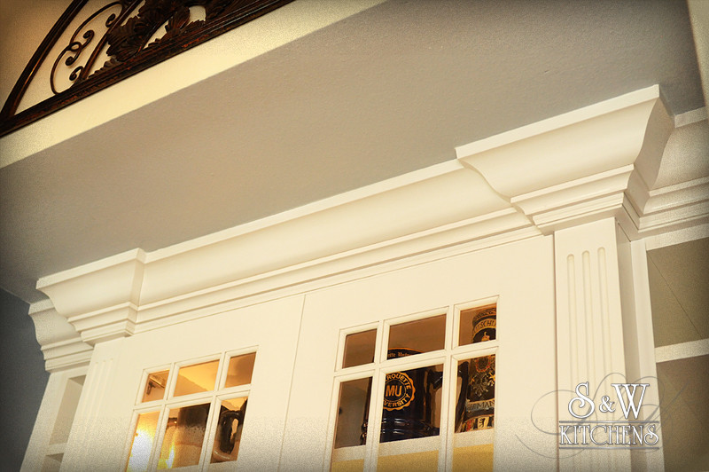 Inspiration for a mid-sized transitional u-shaped dark wood floor open concept kitchen remodel in Orlando with a double-bowl sink, raised-panel cabinets, white cabinets, granite countertops, beige backsplash, subway tile backsplash and stainless steel appliances