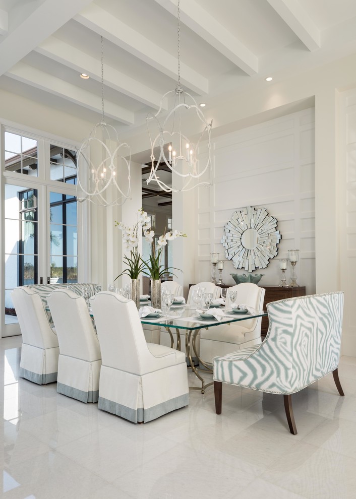 Photo of a large transitional separate dining room in Miami with white walls, porcelain floors, no fireplace and white floor.