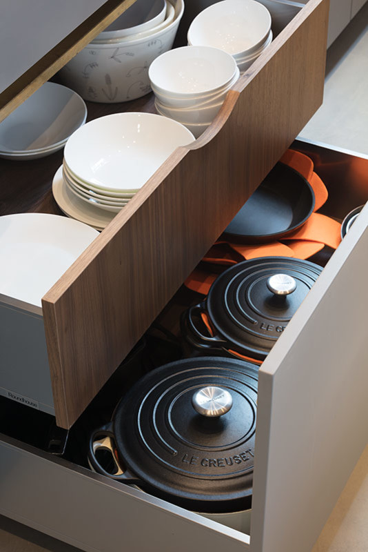 Design ideas for a large contemporary l-shaped open plan kitchen in London with a submerged sink, flat-panel cabinets, grey cabinets, marble worktops, white splashback, marble splashback, stainless steel appliances, concrete flooring, an island, grey floors and white worktops.