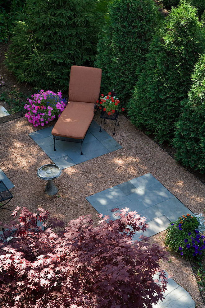 Design ideas for a small transitional backyard patio in Chicago with decomposed granite and no cover.