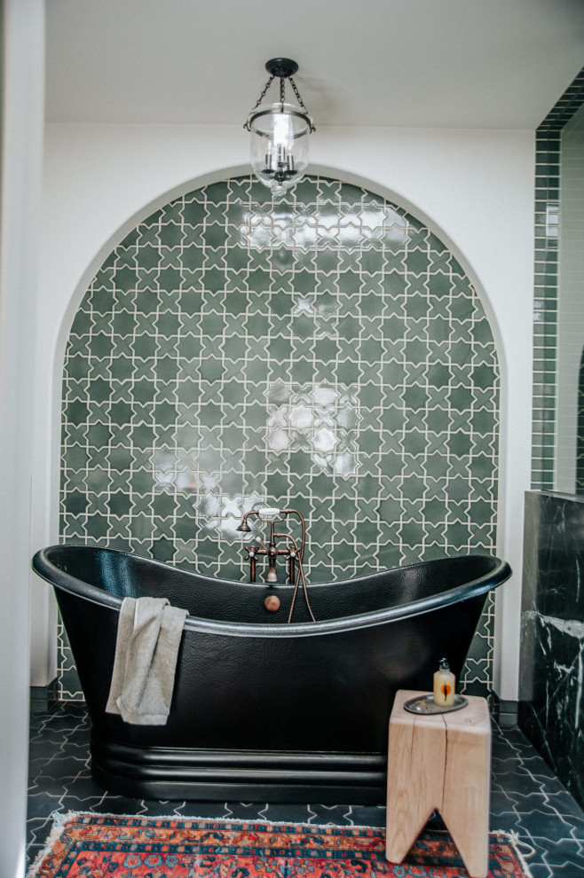 Large traditional master bathroom in Los Angeles with a freestanding tub, a corner shower, green tile, ceramic tile, ceramic floors, black floor, an enclosed toilet and a freestanding vanity.