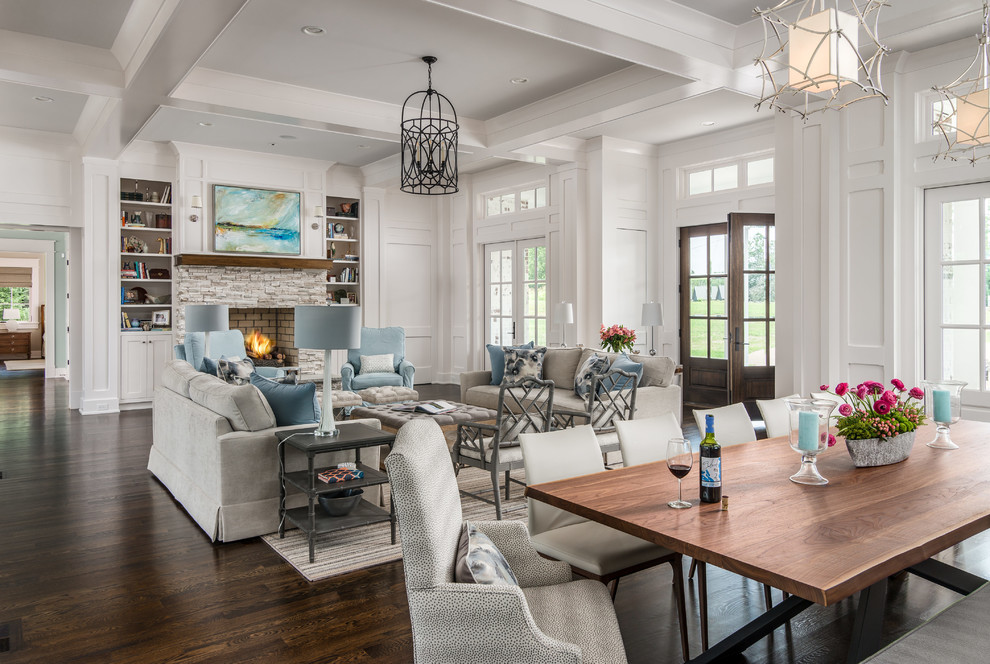 Large transitional open concept living room in Nashville with white walls, dark hardwood floors, a standard fireplace, a stone fireplace surround and no tv.