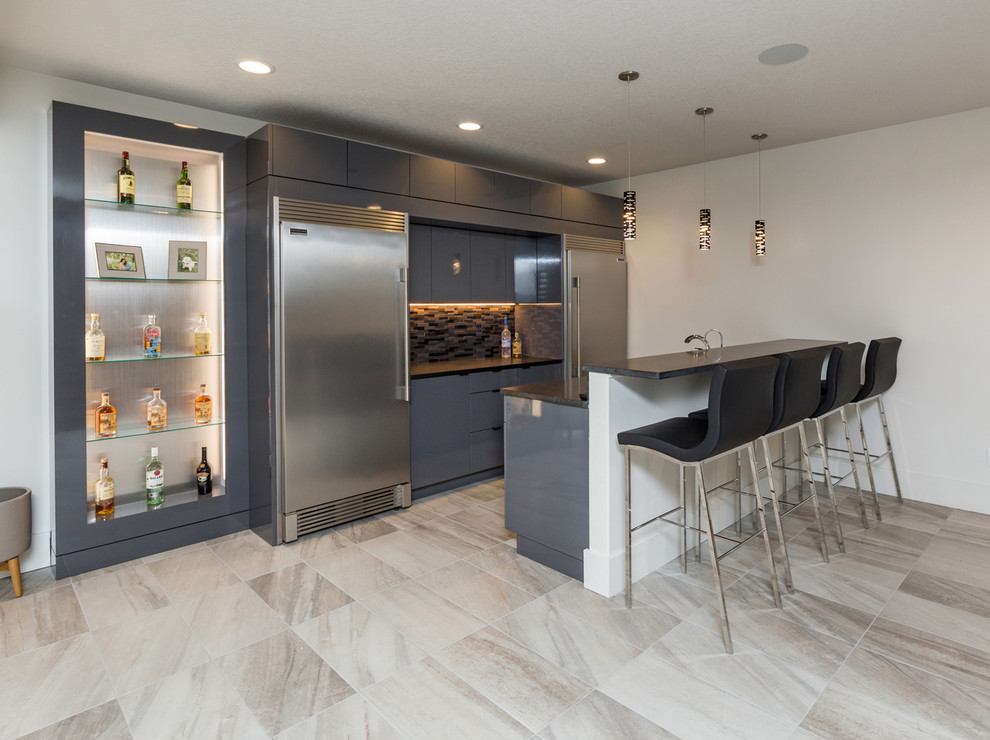 Design ideas for a contemporary home bar in Other with flat-panel cabinets, blue cabinets, grey splashback, matchstick tile splashback and grey floor.