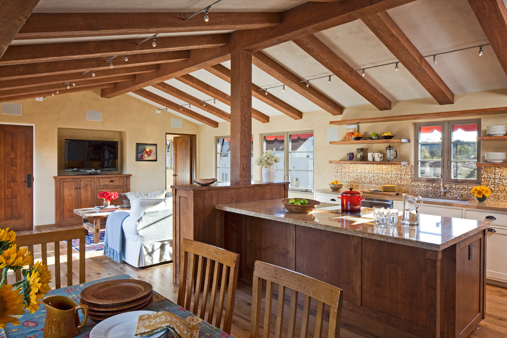 Mid-sized mediterranean l-shaped open plan kitchen in Santa Barbara with open cabinets, multi-coloured splashback, ceramic splashback, medium hardwood floors, with island and medium wood cabinets.