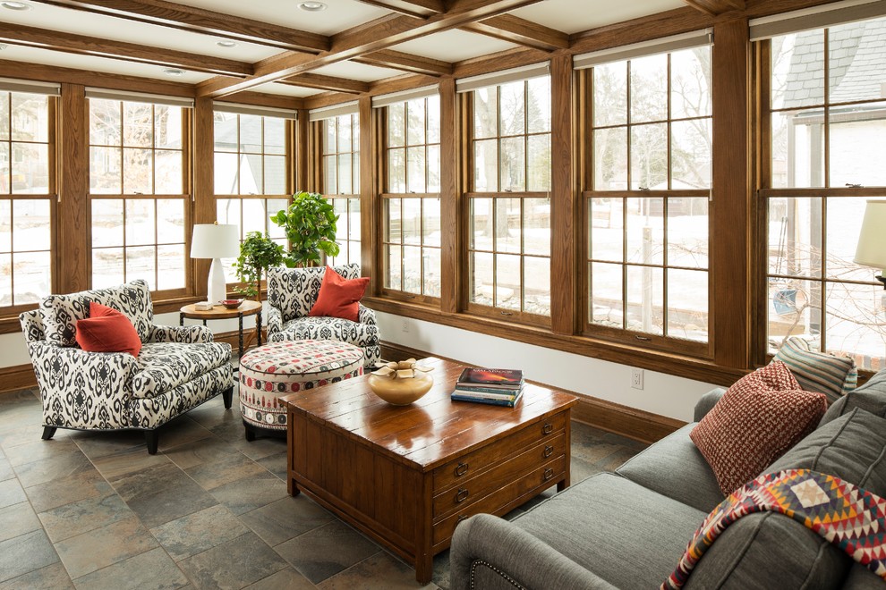 This is an example of an arts and crafts sunroom in Minneapolis with no fireplace and a standard ceiling.