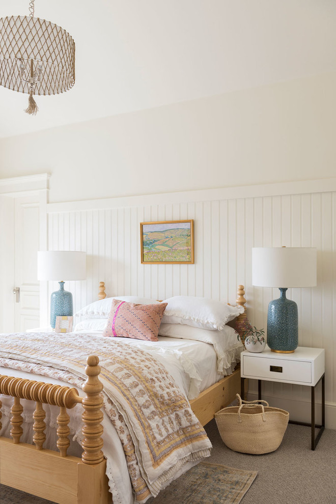 Design ideas for a large beach style guest bedroom in Salt Lake City with white walls, carpet, no fireplace and grey floor.