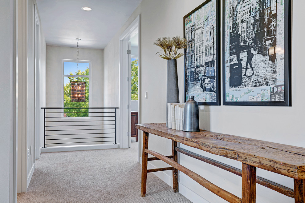This is an example of a contemporary hallway in Seattle with carpet.