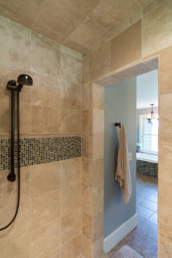 Photo of a large arts and crafts master bathroom in Portland Maine with an alcove shower, beige tile, stone tile, grey walls, an undermount sink, shaker cabinets, white cabinets, an alcove tub, ceramic floors, granite benchtops, brown floor and an open shower.