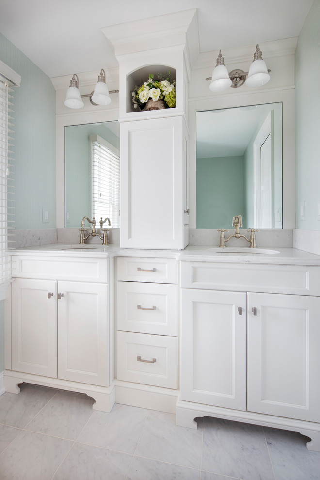 Mid-sized transitional master bathroom in Other with recessed-panel cabinets, white cabinets, an undermount sink, engineered quartz benchtops, a two-piece toilet, white tile, stone slab, blue walls, marble floors and white floor.
