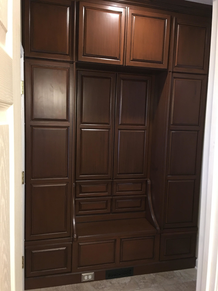Kitchen - large transitional kitchen idea with raised-panel cabinets and brown cabinets