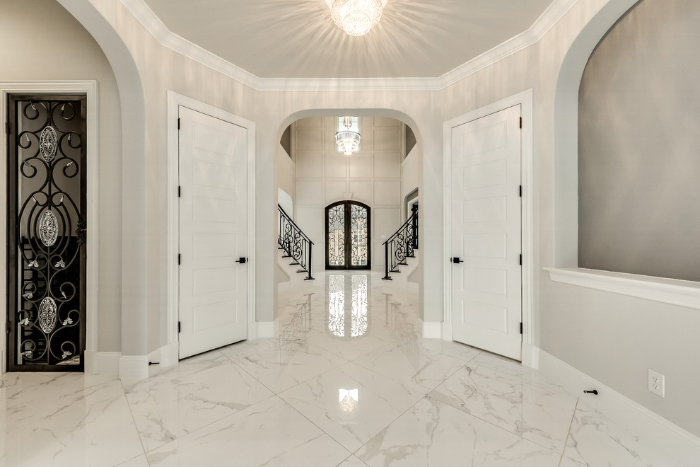 Design ideas for a large transitional foyer in Dallas with grey walls, marble floors, a double front door, a black front door and white floor.