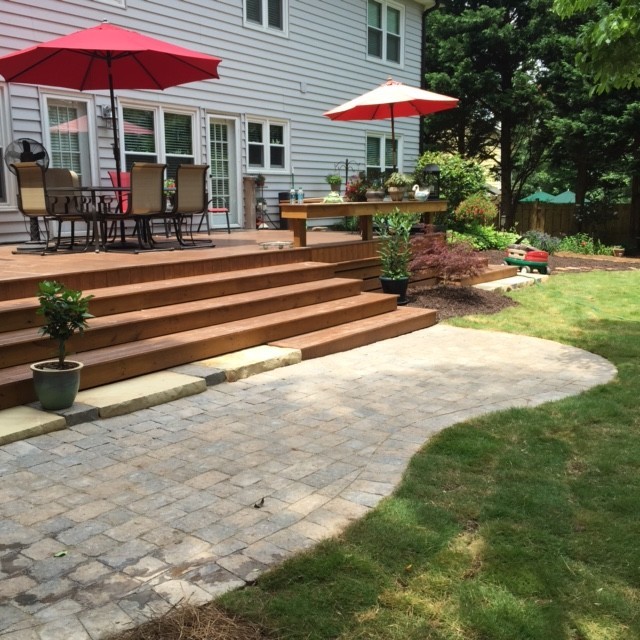 Large traditional backyard patio in Atlanta with concrete pavers and no cover.