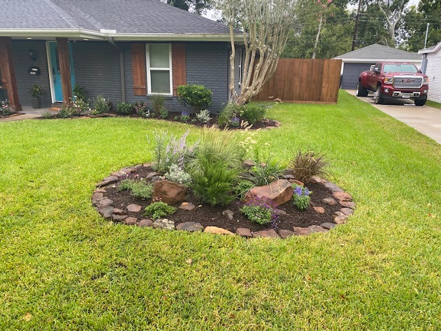 Backyard flagstone walking path with firepit and seating area