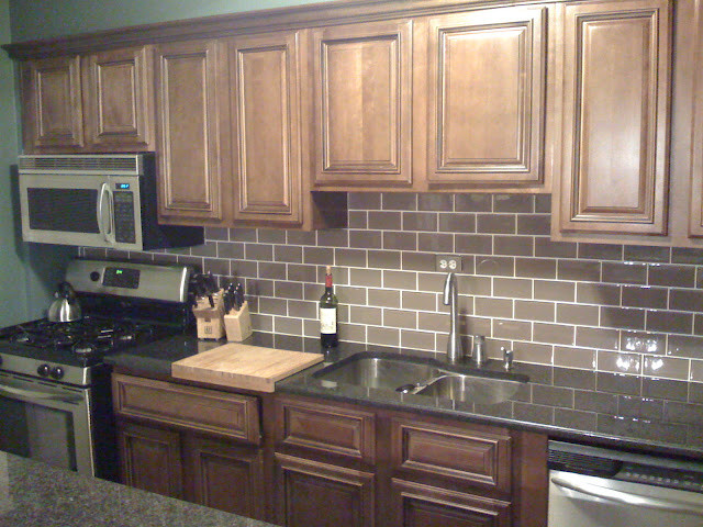 Inspiration for a transitional kitchen remodel in DC Metro with beaded inset cabinets, dark wood cabinets and granite countertops