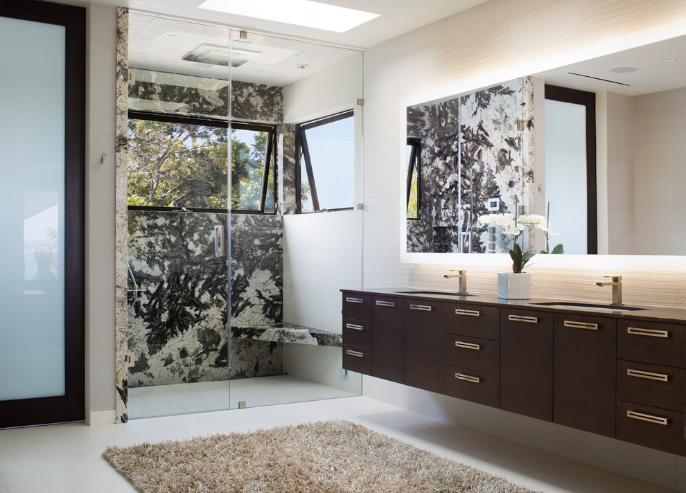 Design ideas for a contemporary bathroom in San Diego with flat-panel cabinets, dark wood cabinets, a curbless shower, white tile, white walls, an undermount sink, beige floor, a hinged shower door and brown benchtops.