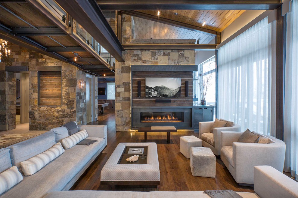 Design ideas for a country formal open concept living room in Denver with medium hardwood floors, a ribbon fireplace and a wall-mounted tv.