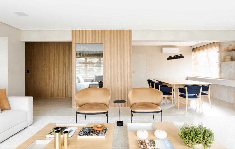 Inspiration pour un grand salon minimaliste ouvert avec parquet clair, un sol beige et du lambris.