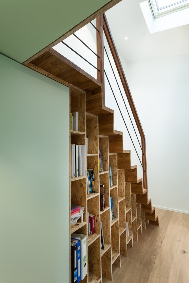 Photo of a small scandinavian wood straight staircase in Bordeaux with wood risers.