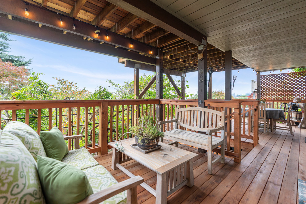 Inspiration for a large rustic backyard second story wood railing deck remodel in San Francisco with no cover