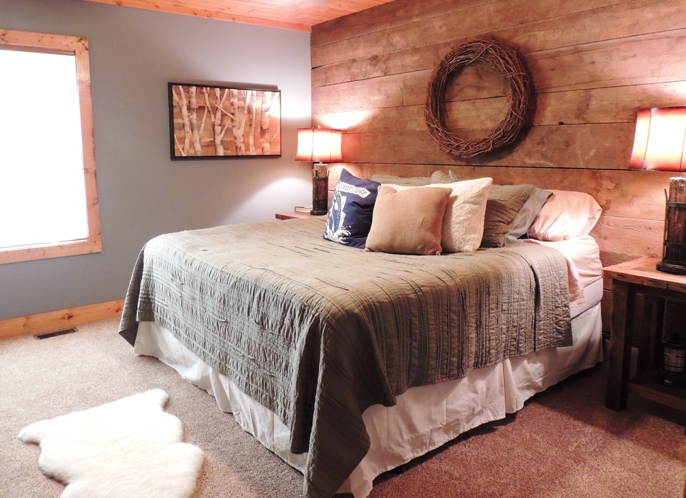 This is an example of a mid-sized country master bedroom in Other with blue walls and carpet.