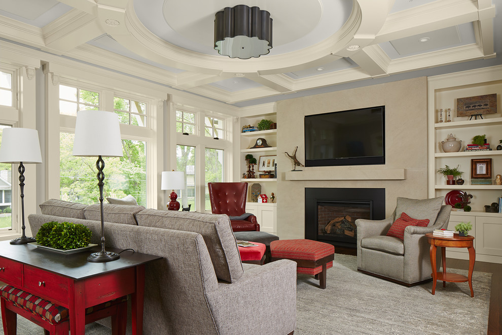 Example of a large transitional enclosed dark wood floor and brown floor family room design in Minneapolis with a standard fireplace, a wall-mounted tv and a tile fireplace