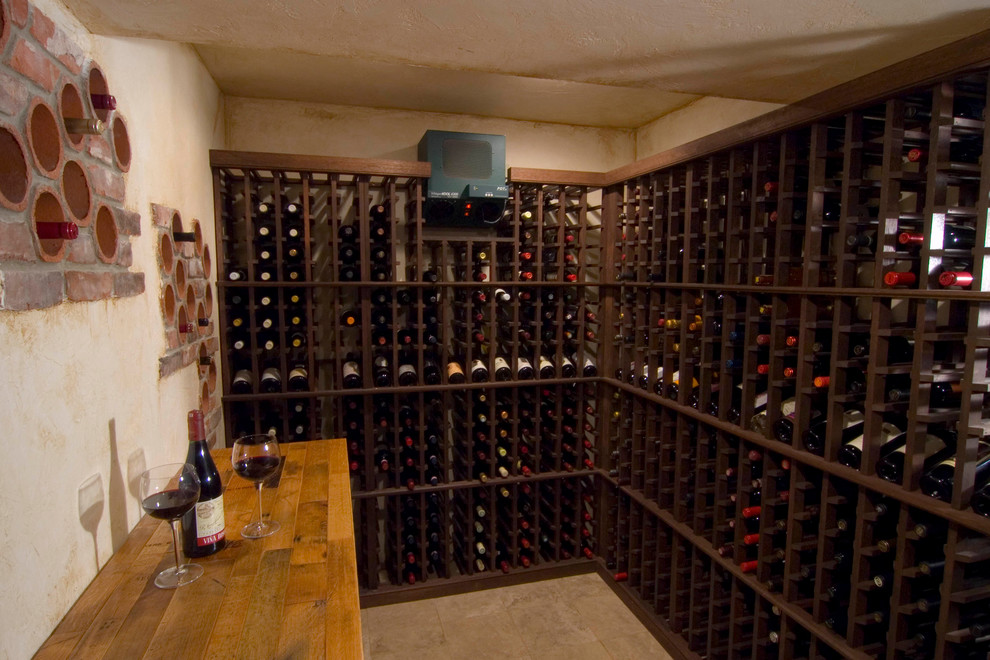 Inspiration for a mid-sized traditional wine cellar in Philadelphia with ceramic floors and diamond bins.