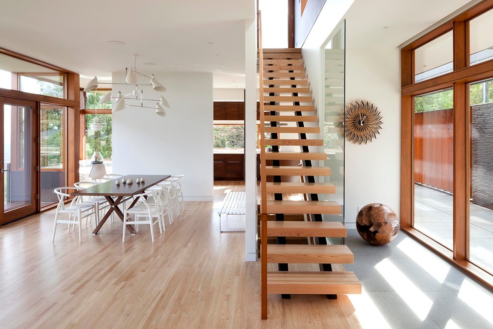 Design ideas for a mid-sized contemporary wood straight staircase in Portland.