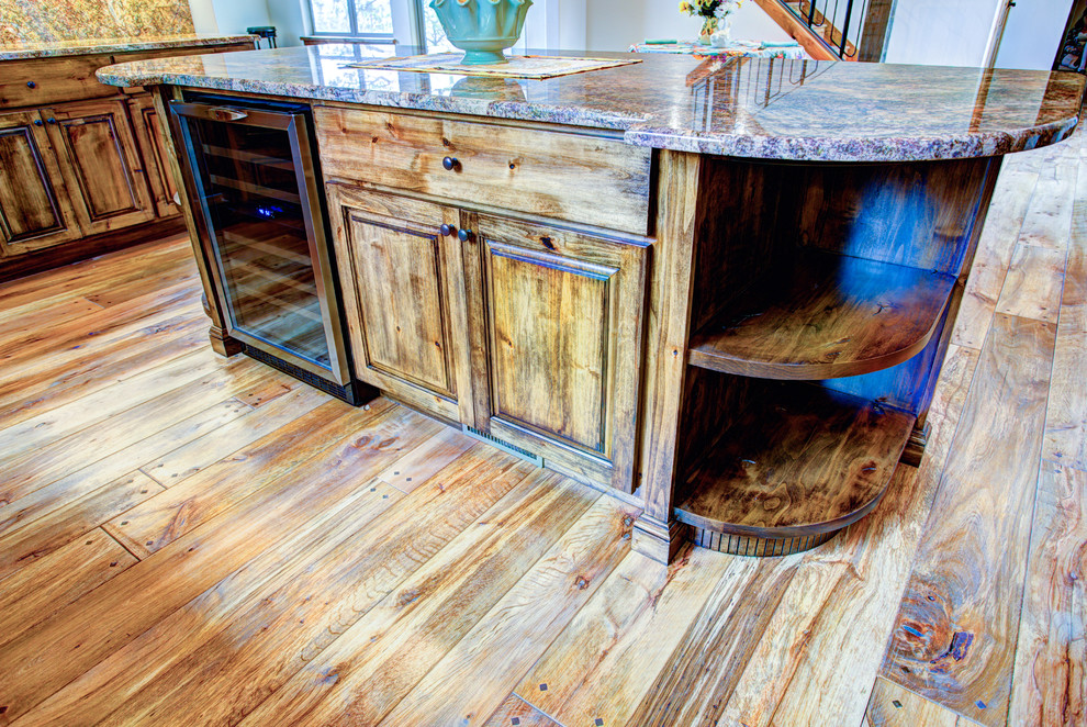 Inspiration for a large rustic u-shaped medium tone wood floor kitchen pantry remodel with a drop-in sink, glass-front cabinets, medium tone wood cabinets, beige backsplash, stainless steel appliances and an island