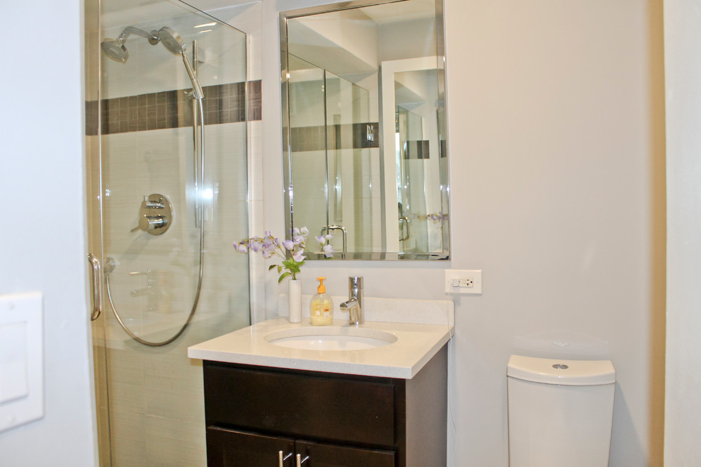 Small contemporary master bathroom in Chicago with beaded inset cabinets, dark wood cabinets, an alcove shower, a one-piece toilet, white tile, ceramic tile, white walls, ceramic floors, an integrated sink and engineered quartz benchtops.