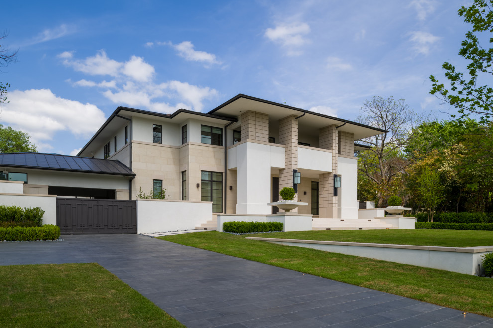 Inspiration for an expansive contemporary two-storey beige house exterior in Dallas with mixed siding and a mixed roof.