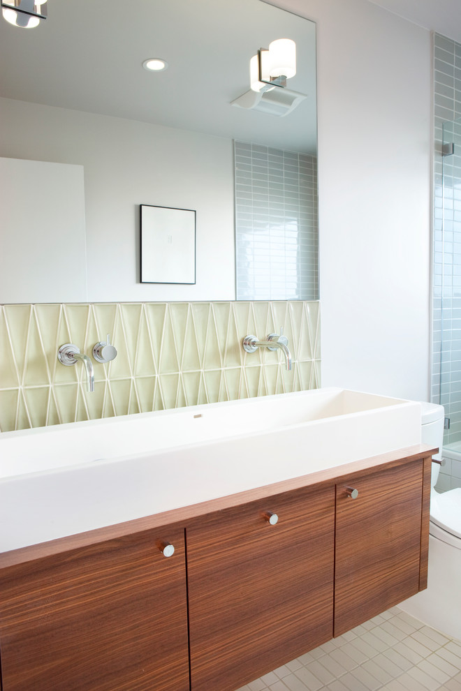 Design ideas for a modern bathroom in San Francisco with a trough sink and flat-panel cabinets.