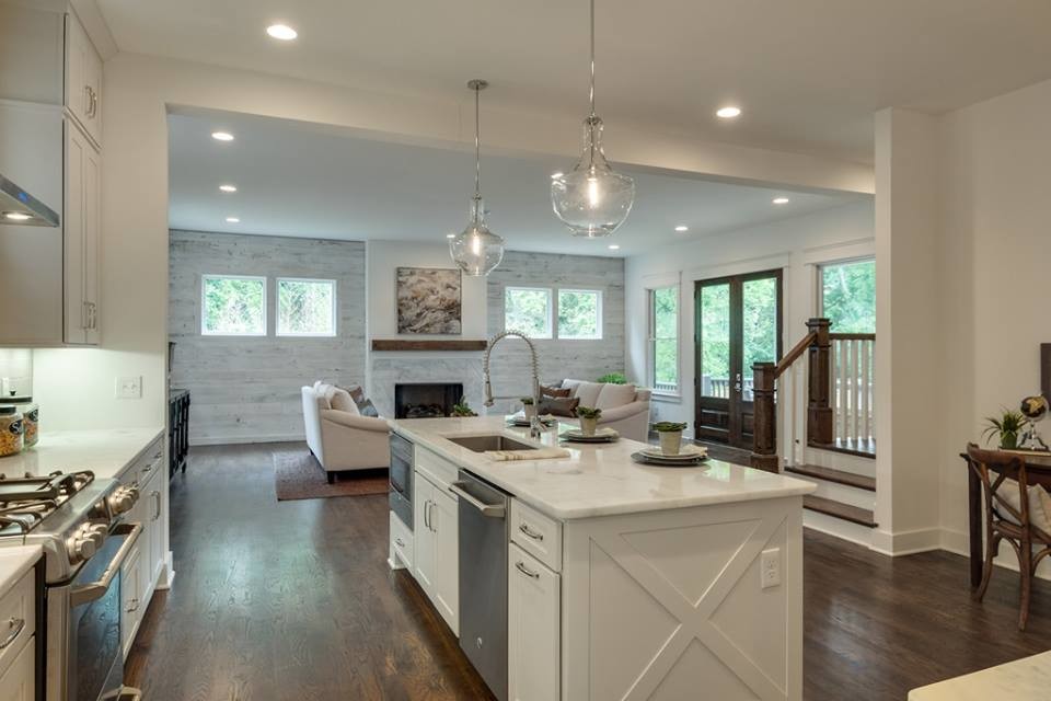 Design ideas for a large transitional galley eat-in kitchen in Nashville with a single-bowl sink, shaker cabinets, white cabinets, quartzite benchtops, grey splashback, subway tile splashback, stainless steel appliances, dark hardwood floors and with island.