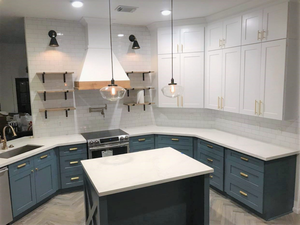 This is an example of a mid-sized transitional u-shaped eat-in kitchen in Houston with turquoise cabinets, white splashback, stainless steel appliances, laminate floors, with island, beige floor, white benchtop, coffered, an undermount sink, shaker cabinets, quartzite benchtops and ceramic splashback.