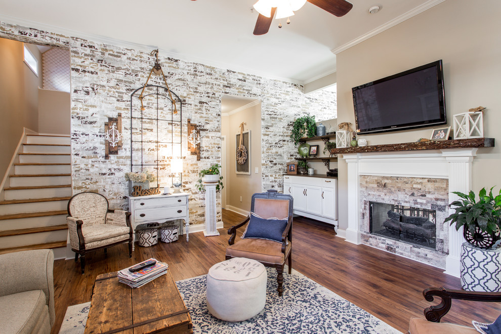 Inspiration for a mid-sized transitional formal enclosed living room in Atlanta with brown walls, medium hardwood floors, a wall-mounted tv, brown floor, a standard fireplace and a tile fireplace surround.