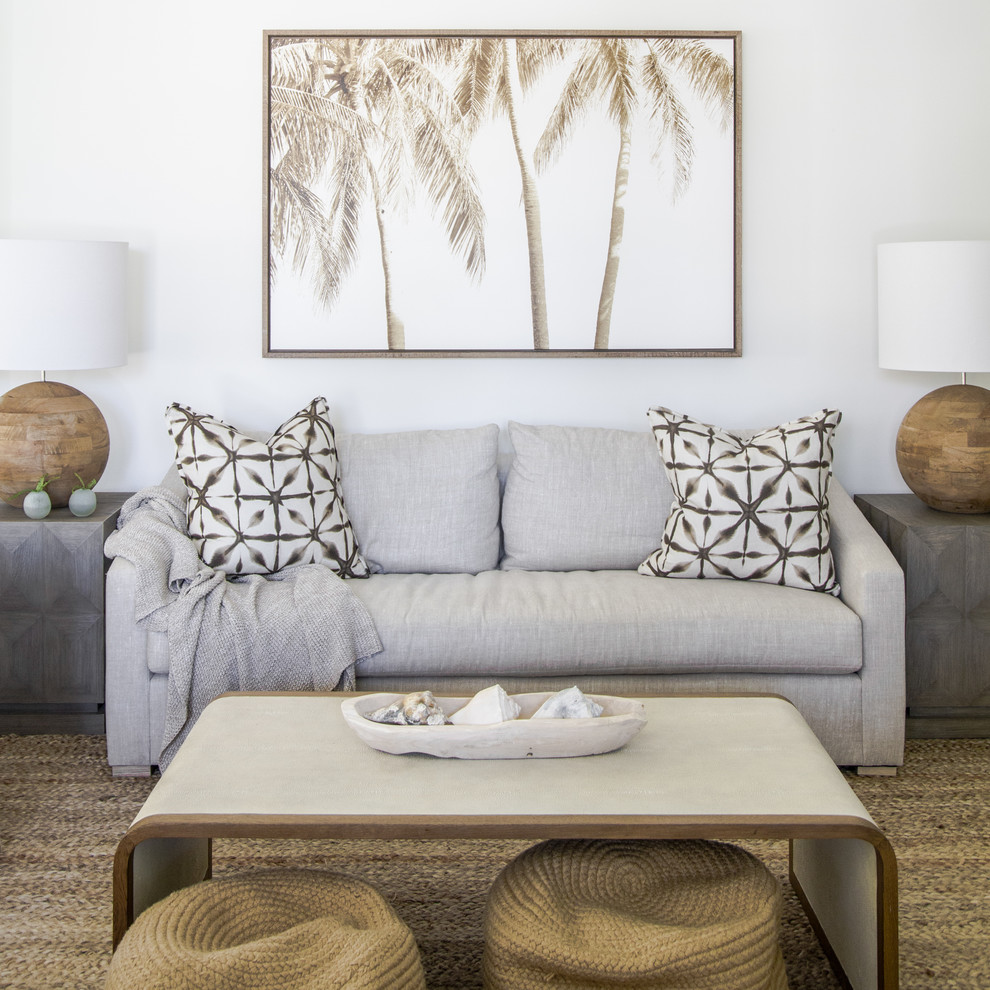 Photo of a beach style living room in Jacksonville with white walls and beige floor.