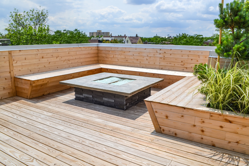 Design ideas for a large contemporary rooftop deck in Chicago with a fire feature and no cover.