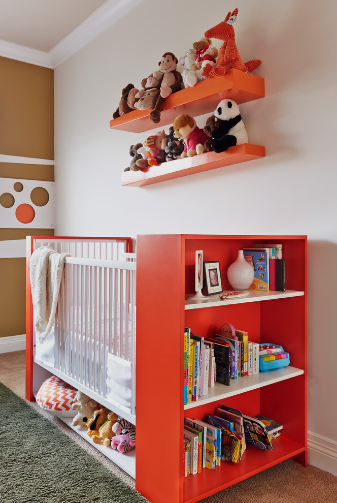 Inspiration for a mid-sized contemporary gender-neutral nursery in Orange County with carpet, white walls and beige floor.